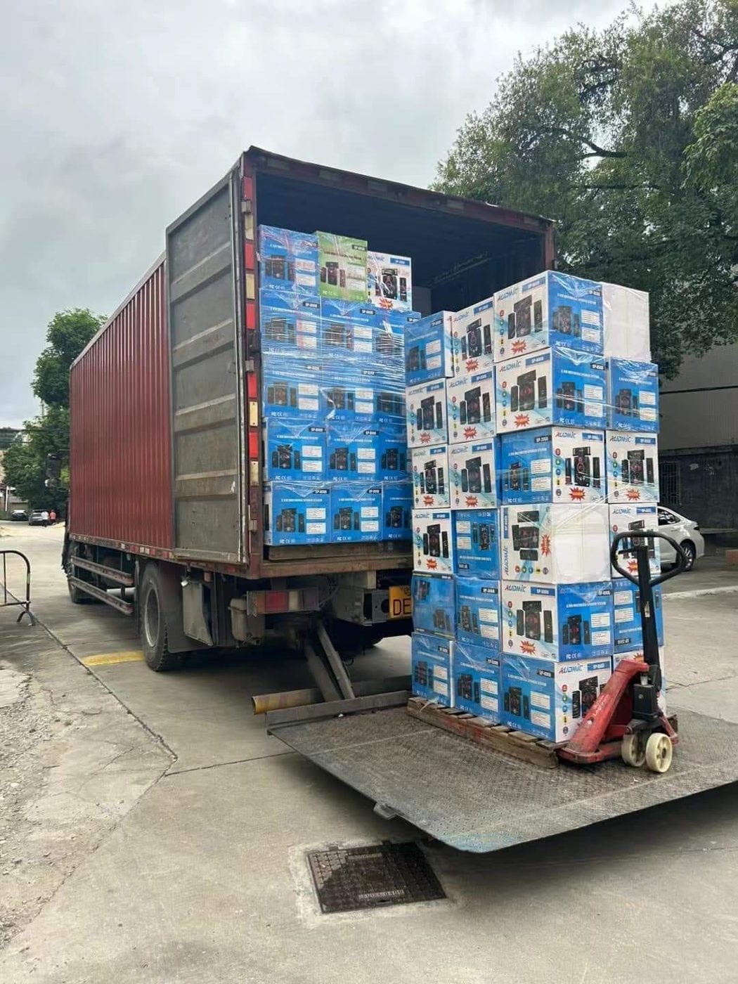 AZ Traders staff loading verified shipment for export