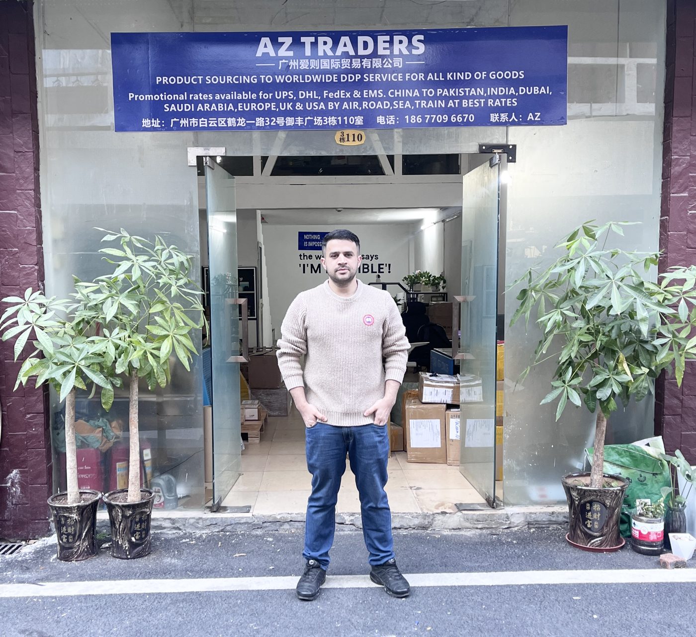 Our founder standing at the entrance of the AZ Traders office in Guangzhou